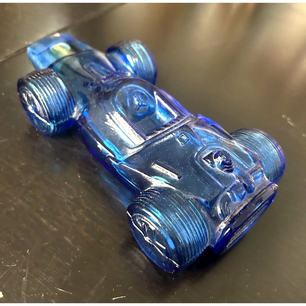 Avon Sure Winner Racing Car Blue Glass Bottle Vintage UV Green Glow